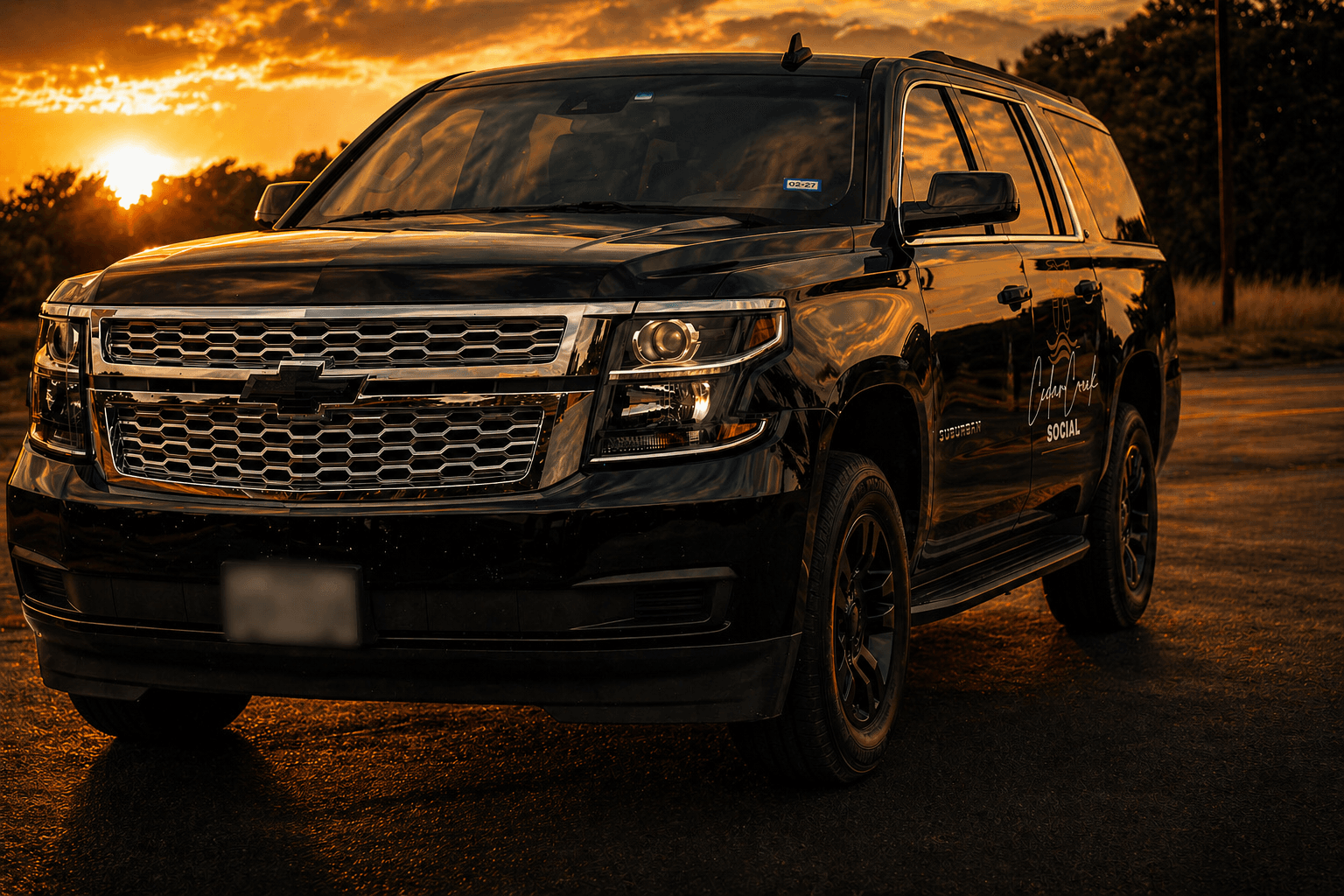 Cedar Creek Social black SUV at sunset